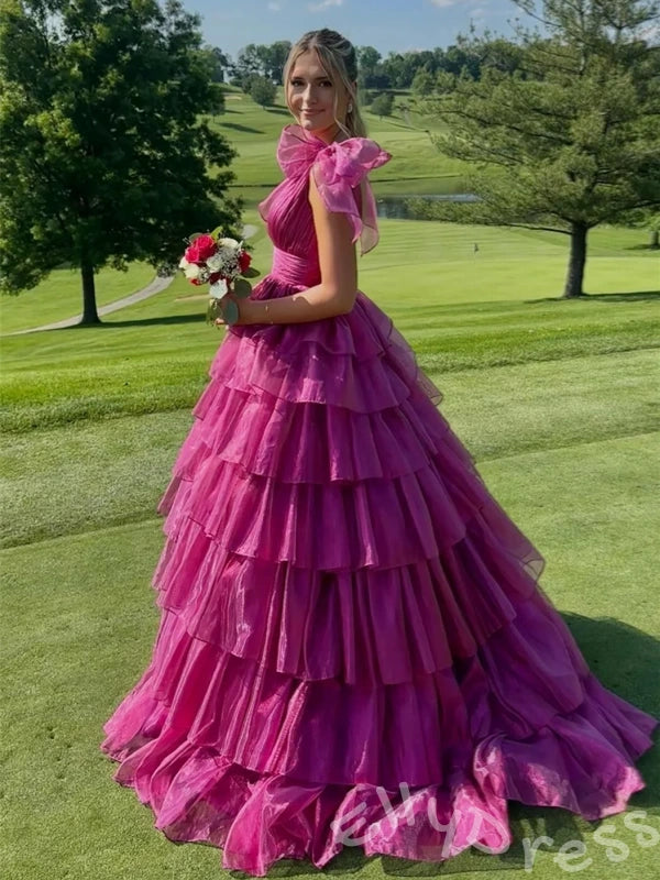 Pink Iridescent Wide Strap Bow Tie Deep V-Neck Tiered Cake Ball Gown Prom Dress with Metallic Jacquard Fabric Wide Waistband Eight-Layer Ruffles and Open Back