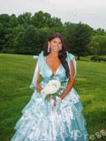 Pink Iridescent Wide Strap Bow Tie Deep V-Neck Tiered Cake Ball Gown Prom Dress with Metallic Jacquard Fabric Wide Waistband Eight-Layer Ruffles and Open Back